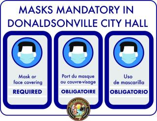 images of mask mandate in three languages masking required at Donaldsonville city hall